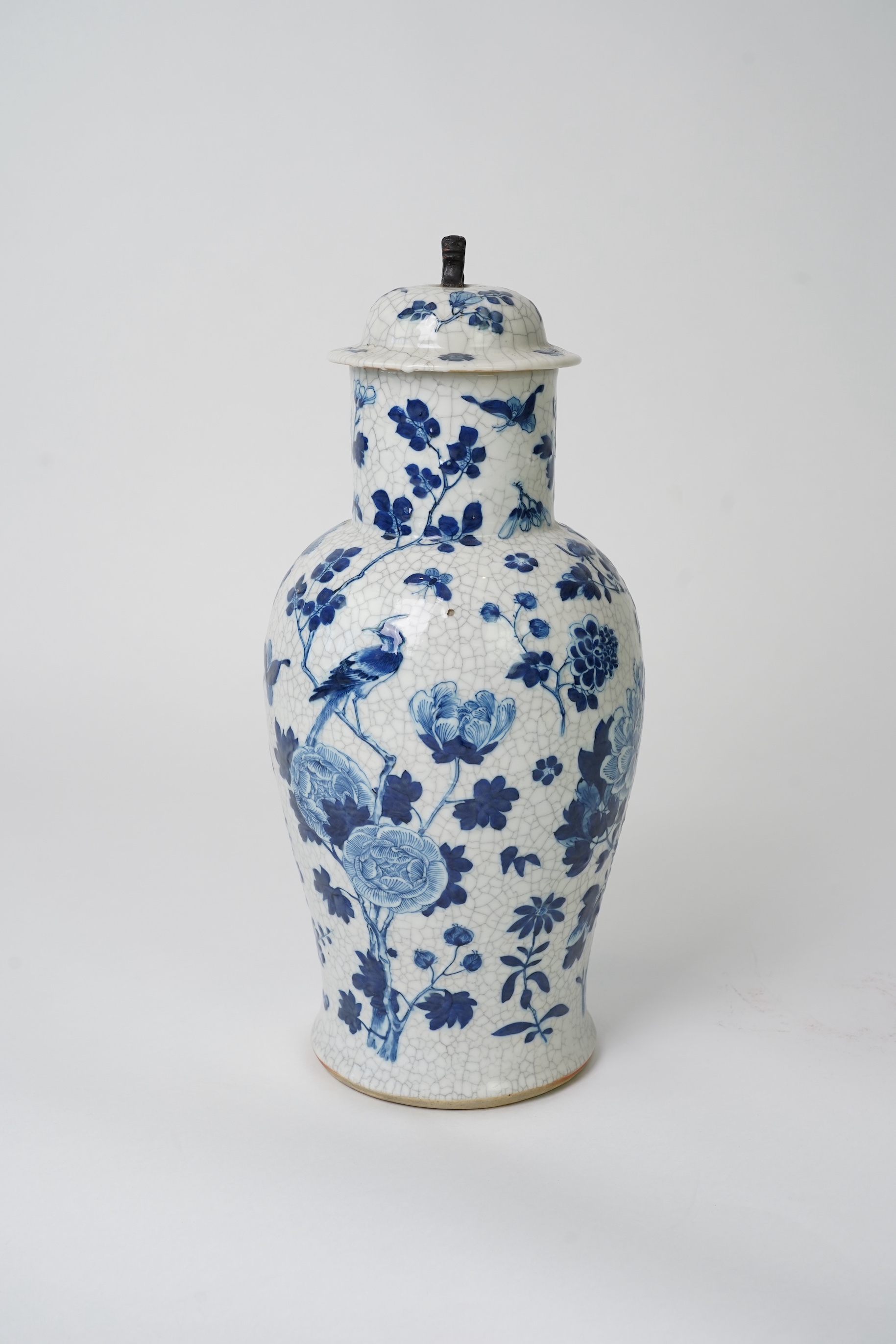 A Chinese blue and white crackle glaze baluster vase and cover, early 20th century